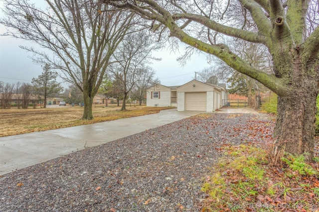 view of side of property with a garage