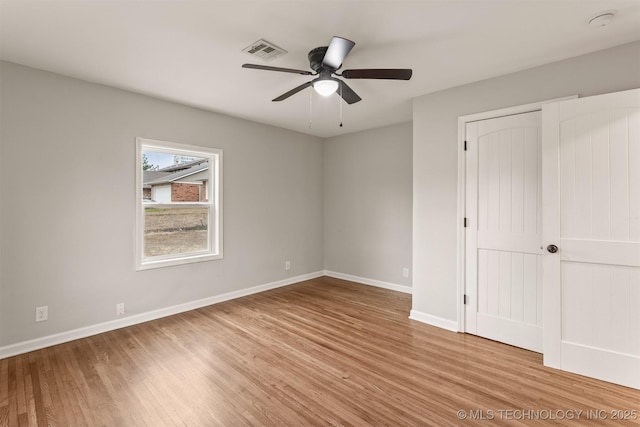 unfurnished bedroom featuring light hardwood / wood-style floors and ceiling fan