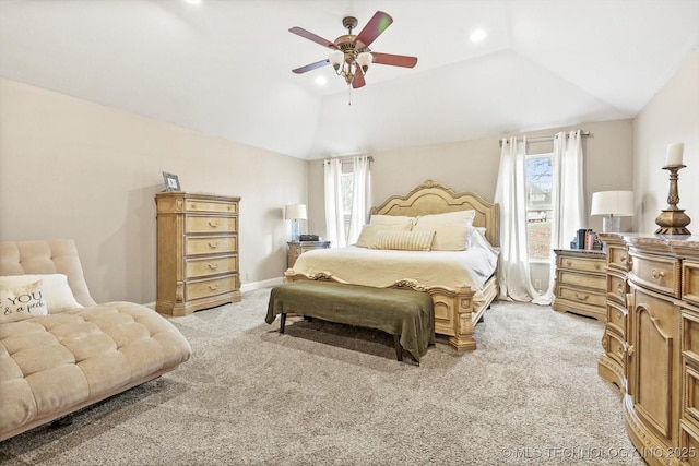 bedroom featuring light carpet, multiple windows, and ceiling fan