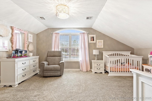 bedroom featuring lofted ceiling, light carpet, and a nursery area