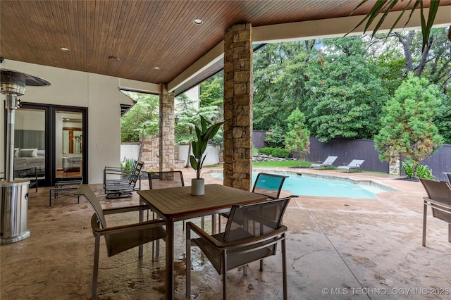 view of patio with a fenced in pool