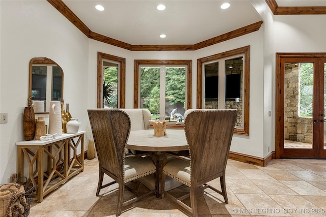 dining area with french doors and crown molding