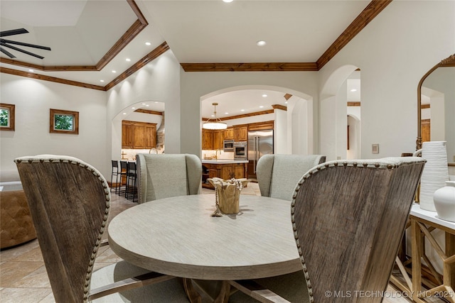 dining room featuring ceiling fan and crown molding