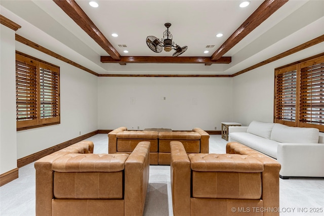 carpeted living room with ceiling fan and ornamental molding