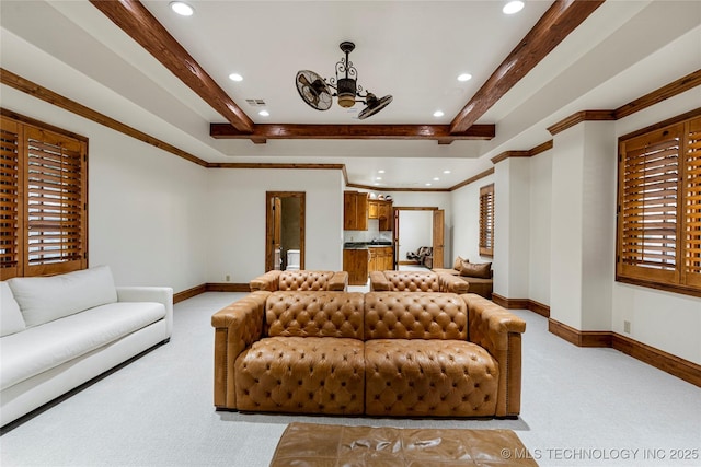 carpeted living room with ornamental molding