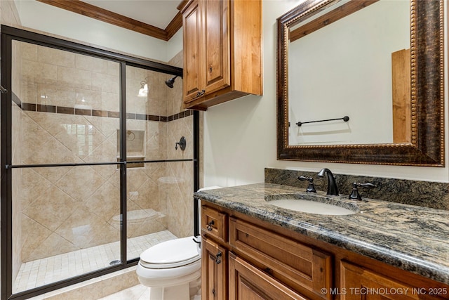 bathroom with vanity, toilet, an enclosed shower, and ornamental molding