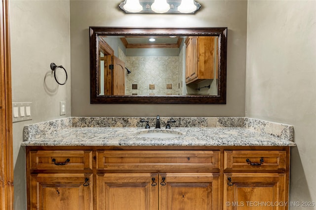 bathroom with vanity and crown molding