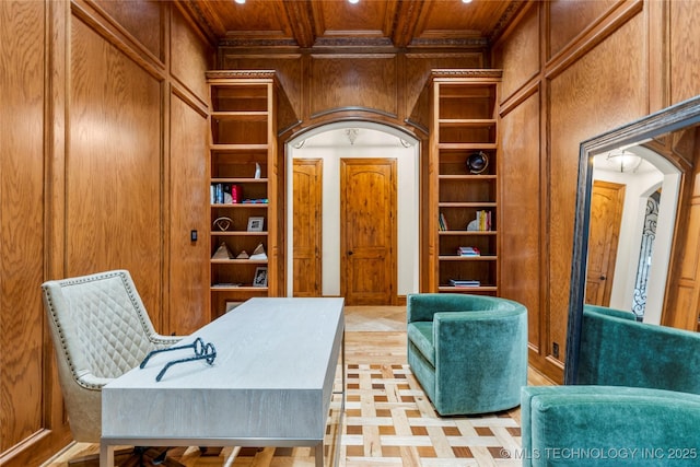 office space with wood walls, beamed ceiling, wood ceiling, and coffered ceiling