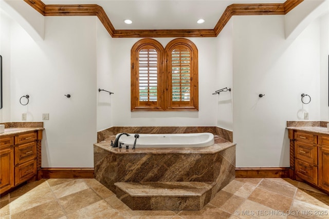 bathroom featuring vanity, crown molding, and tiled bath