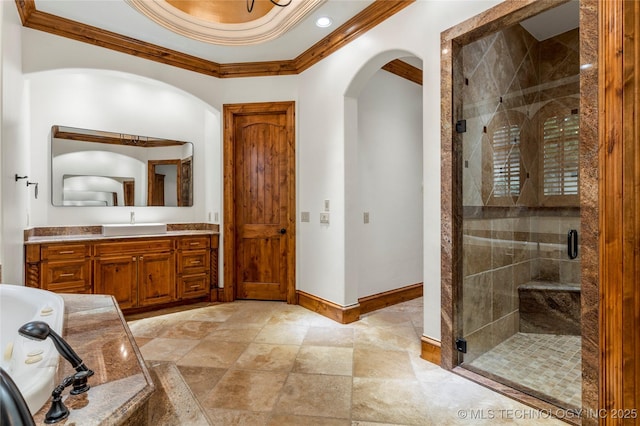 bathroom with vanity, separate shower and tub, and crown molding