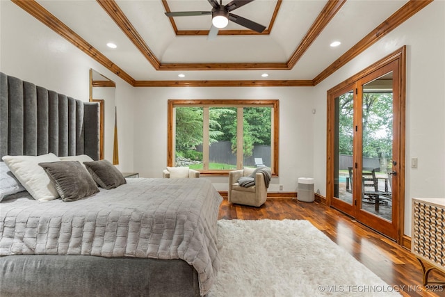 bedroom with access to exterior, a raised ceiling, ceiling fan, crown molding, and wood-type flooring