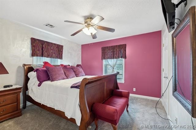 bedroom with ceiling fan and carpet floors