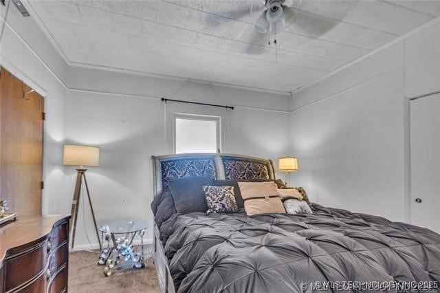 carpeted bedroom with crown molding