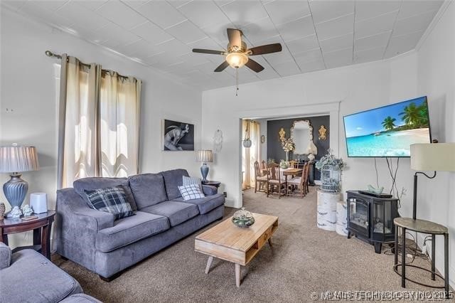 living room with ceiling fan and carpet floors