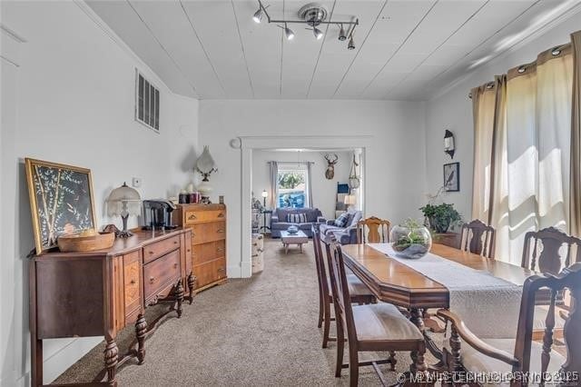 view of carpeted dining area