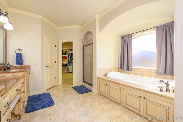 bathroom with tile patterned floors, crown molding, vanity, and independent shower and bath