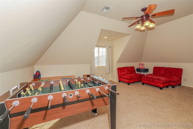 recreation room featuring carpet, ceiling fan, and lofted ceiling