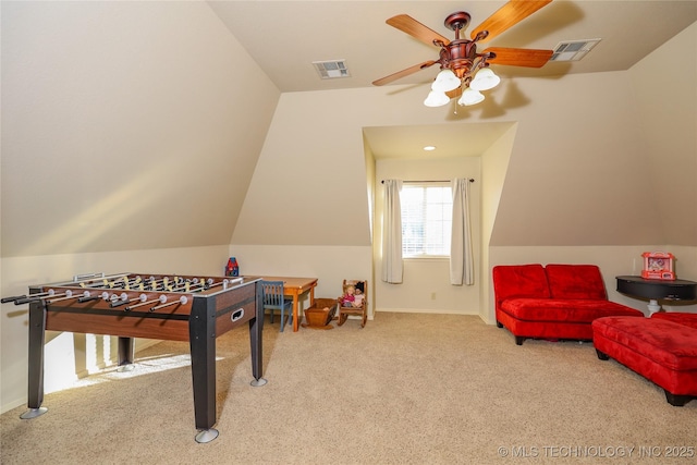 game room with ceiling fan, lofted ceiling, and light carpet