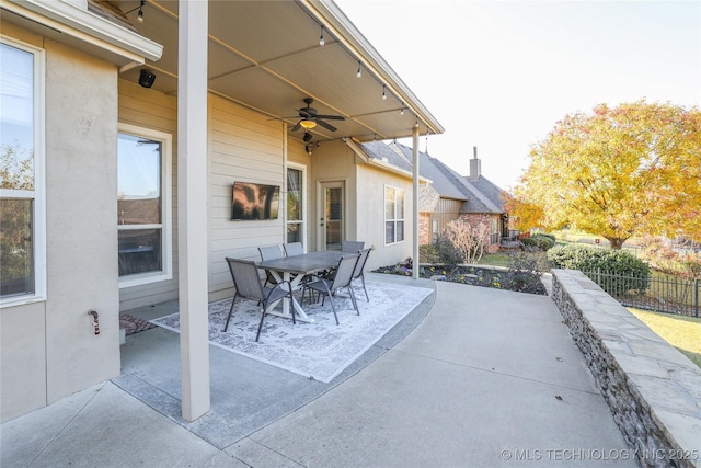 view of patio featuring ceiling fan