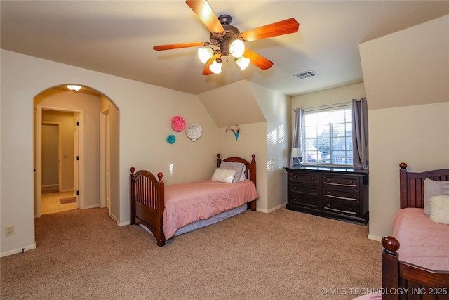 carpeted bedroom featuring ceiling fan and vaulted ceiling