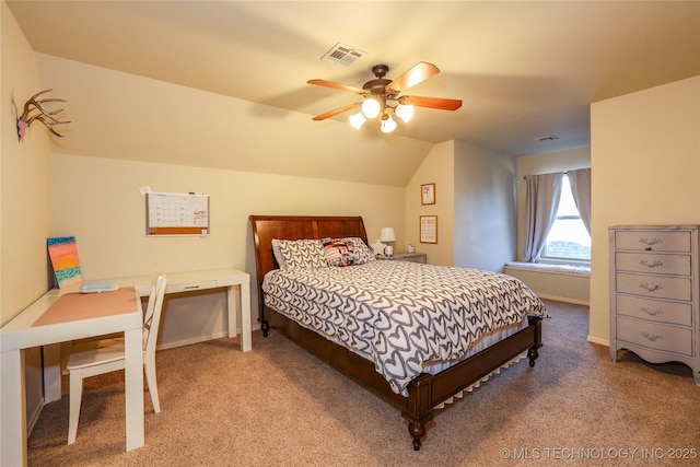 bedroom featuring light colored carpet, vaulted ceiling, and ceiling fan