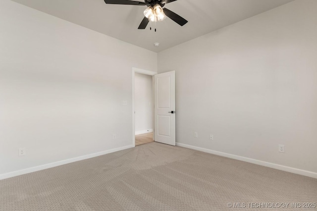 1303 Oakhurst Cir, Claremore, OK 74017 - unfurnished room featuring light carpet, ceiling fan, and baseboards
