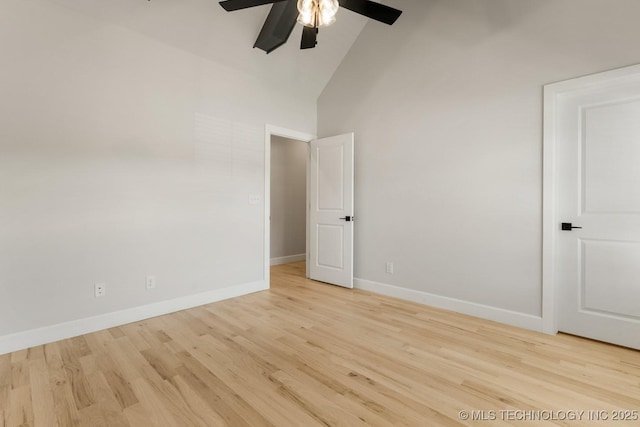 1303 Oakhurst Cir, Claremore, OK 74017 - spare room with ceiling fan, high vaulted ceiling, wood finished floors, and baseboards