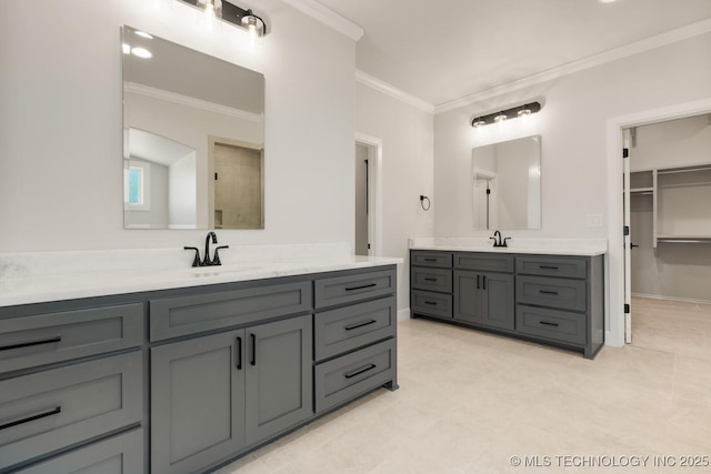 1303 Oakhurst Cir, Claremore, OK 74017 - bathroom with two vanities, ornamental molding, and a spacious closet