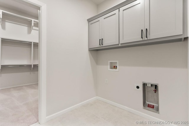 1303 Oakhurst Cir, Claremore, OK 74017 - laundry area featuring washer hookup, cabinet space, electric dryer hookup, and baseboards