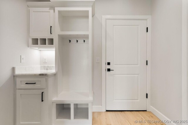 1303 Oakhurst Cir, Claremore, OK 74017 - mudroom with light wood-style floors and baseboards