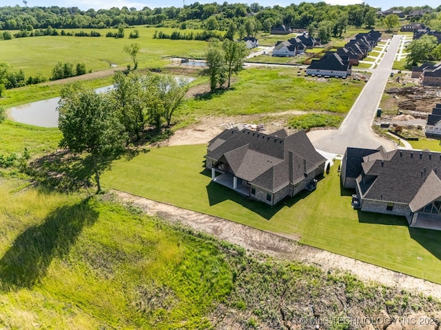 1303 Oakhurst Cir, Claremore, OK 74017 - aerial perspective of suburban area with a large body of water