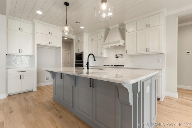 1303 Oakhurst Cir, Claremore, OK 74017 - kitchen featuring premium range hood, a sink, appliances with stainless steel finishes, white cabinetry, and recessed lighting