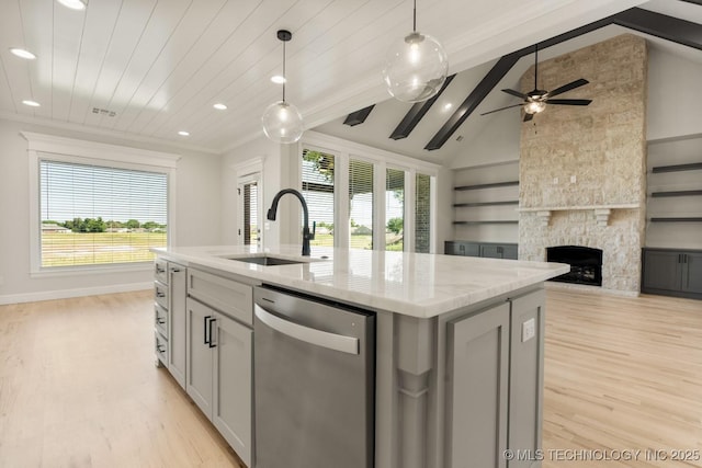 1303 Oakhurst Cir, Claremore, OK 74017 - kitchen featuring dishwasher, a sink, light wood-type flooring, open floor plan, and recessed lighting