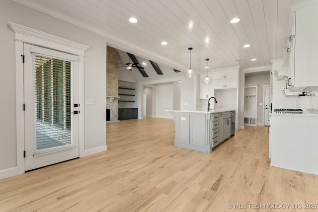 1303 Oakhurst Cir, Claremore, OK 74017 - kitchen featuring recessed lighting, white cabinets, a sink, a ceiling fan, and light countertops