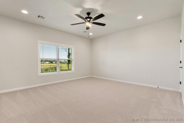 1303 Oakhurst Cir, Claremore, OK 74017 - spare room featuring light colored carpet, baseboards, recessed lighting, and a ceiling fan