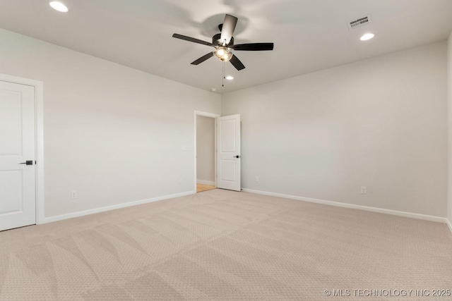 1303 Oakhurst Cir, Claremore, OK 74017 - spare room featuring light carpet, ceiling fan, baseboards, and recessed lighting
