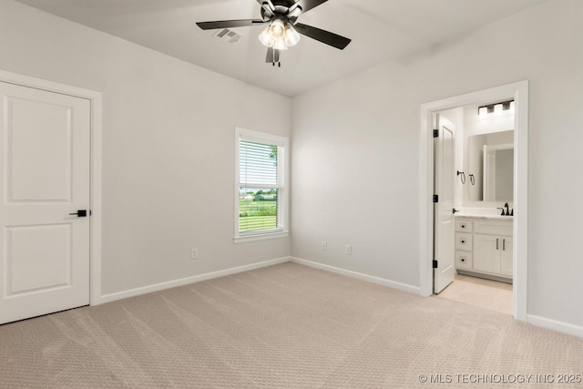 1303 Oakhurst Cir, Claremore, OK 74017 - unfurnished bedroom with light colored carpet, baseboards, a sink, and ensuite bathroom
