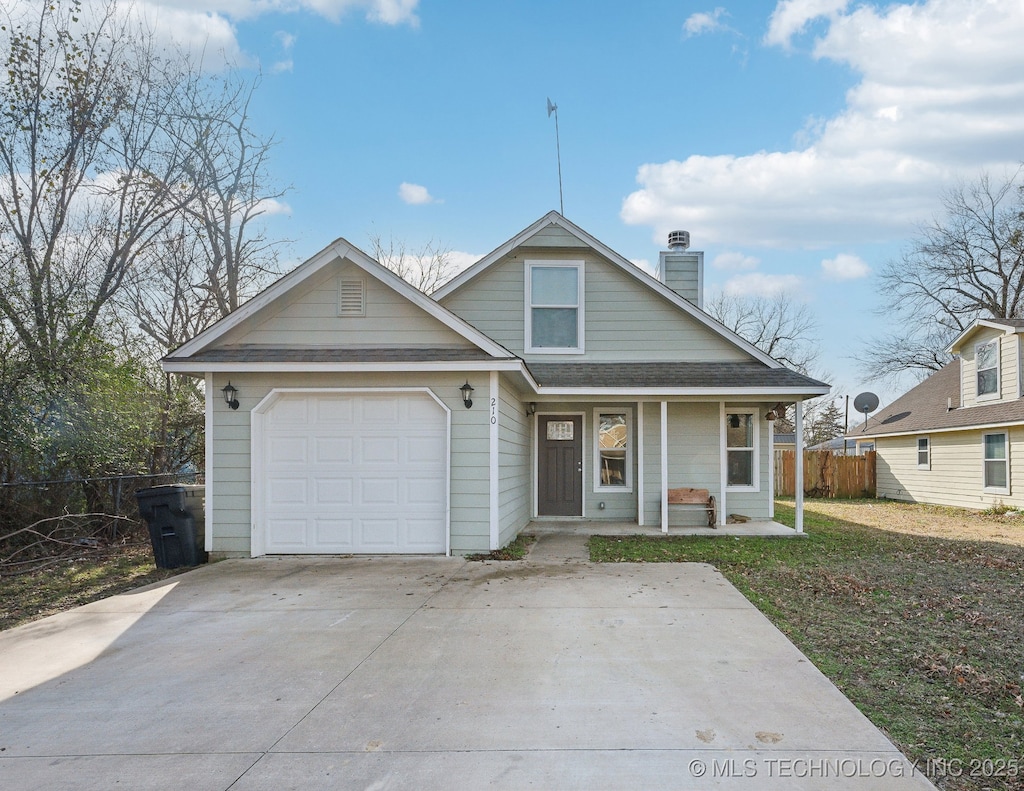 view of front of property with a porch and a garage