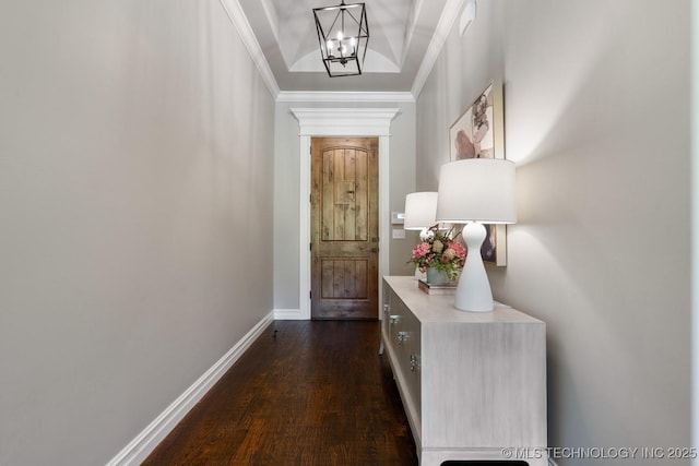 2787 Forest View Dr, Claremore, OK 74017 - doorway featuring a chandelier, dark wood finished floors, ornamental molding, and baseboards