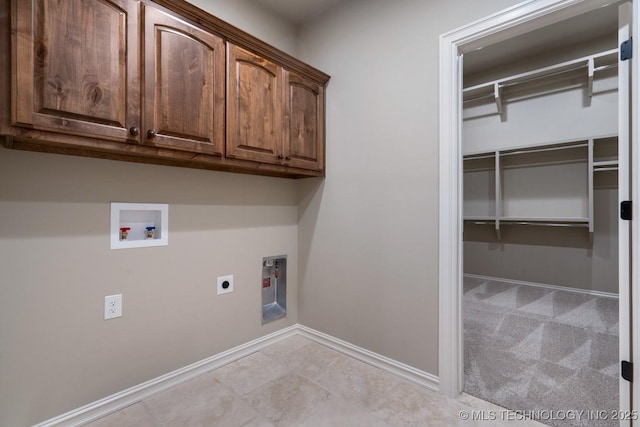 2787 Forest View Dr, Claremore, OK 74017 - laundry room with electric dryer hookup, cabinet space, hookup for a washing machine, and baseboards