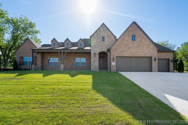 2787 Forest View Dr, Claremore, OK 74017 - view of front of property featuring a front lawn, concrete driveway, brick siding, and a garage