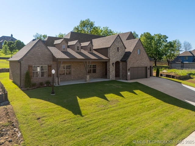 2787 Forest View Dr, Claremore, OK 74017 - view of front of home with brick siding, an attached garage, and driveway