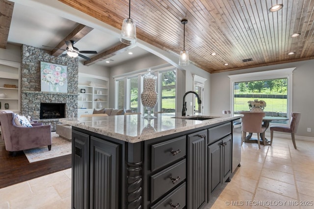 2787 Forest View Dr, Claremore, OK 74017 - kitchen with a sink, stainless steel dishwasher, a ceiling fan, a center island with sink, and recessed lighting