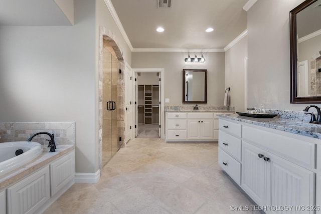 2787 Forest View Dr, Claremore, OK 74017 - bathroom with a shower stall, two vanities, crown molding, a bath, and a walk in closet