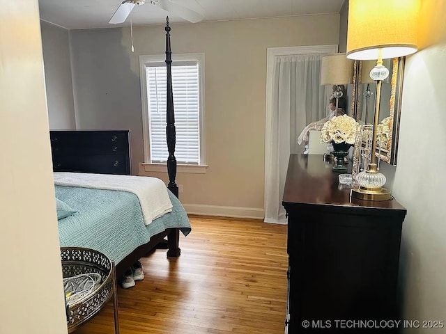 bedroom featuring hardwood / wood-style flooring and ceiling fan