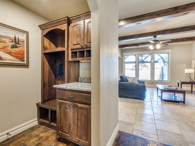 mudroom with beamed ceiling and ceiling fan