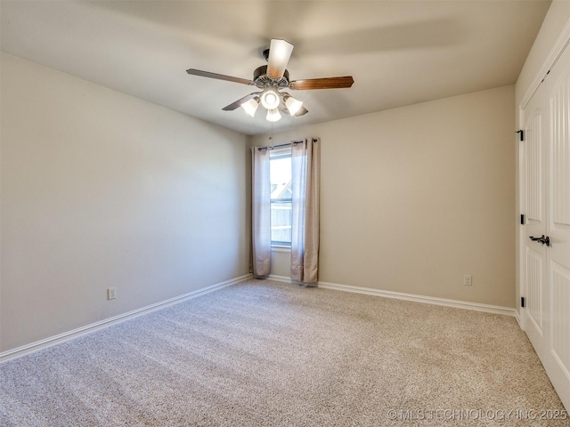 carpeted empty room with ceiling fan