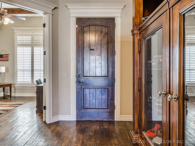 foyer with ceiling fan and dark hardwood / wood-style floors