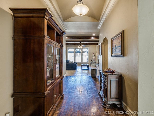 hallway with dark hardwood / wood-style floors and vaulted ceiling