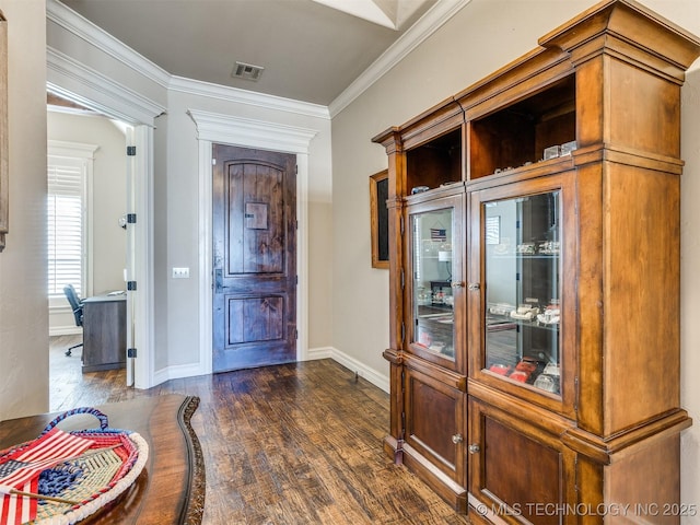 foyer featuring crown molding and dark hardwood / wood-style flooring